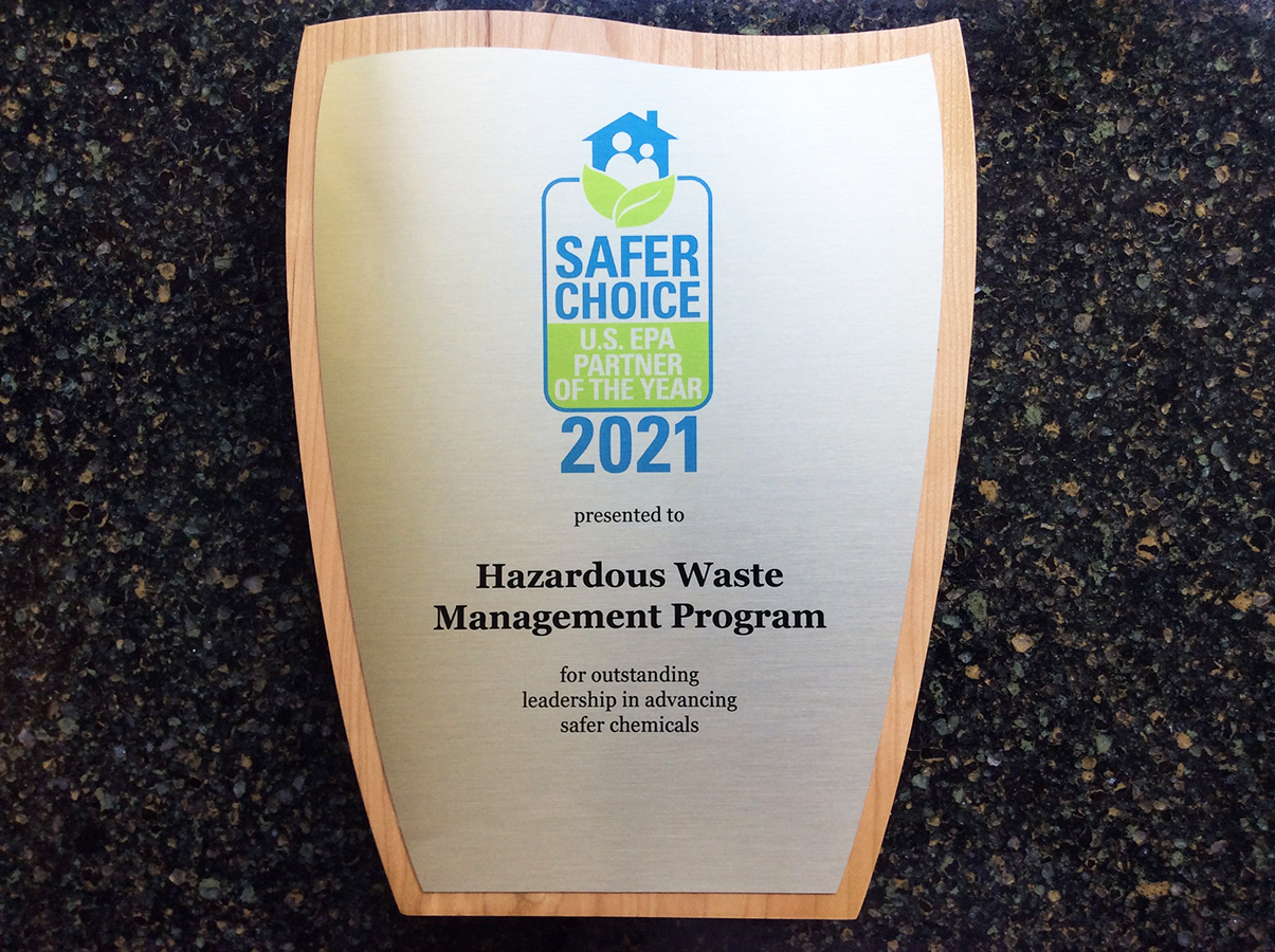 An award that has the Safer Choice logo on it with the year 2021 and Hazardous Waste Management Program name printed on it
