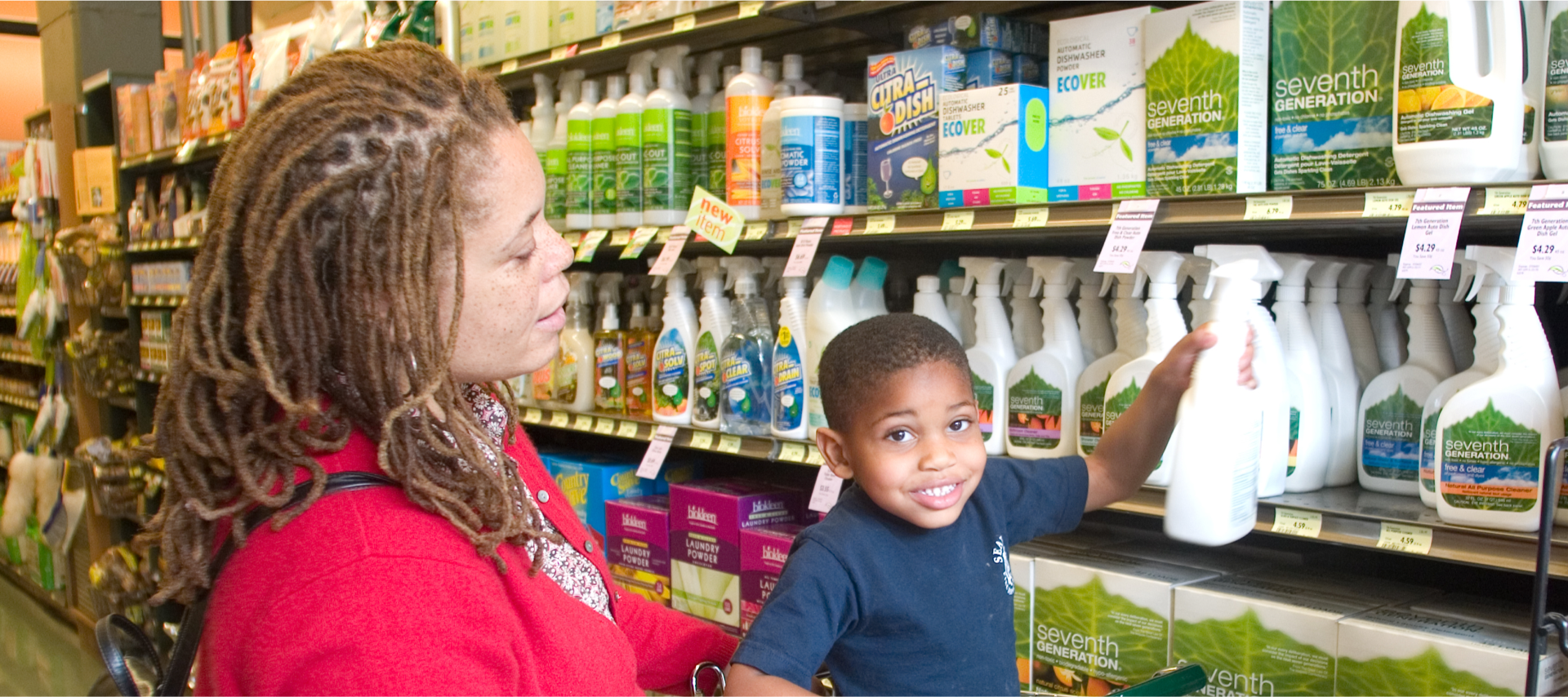 a mother and son in a grocery store aisle